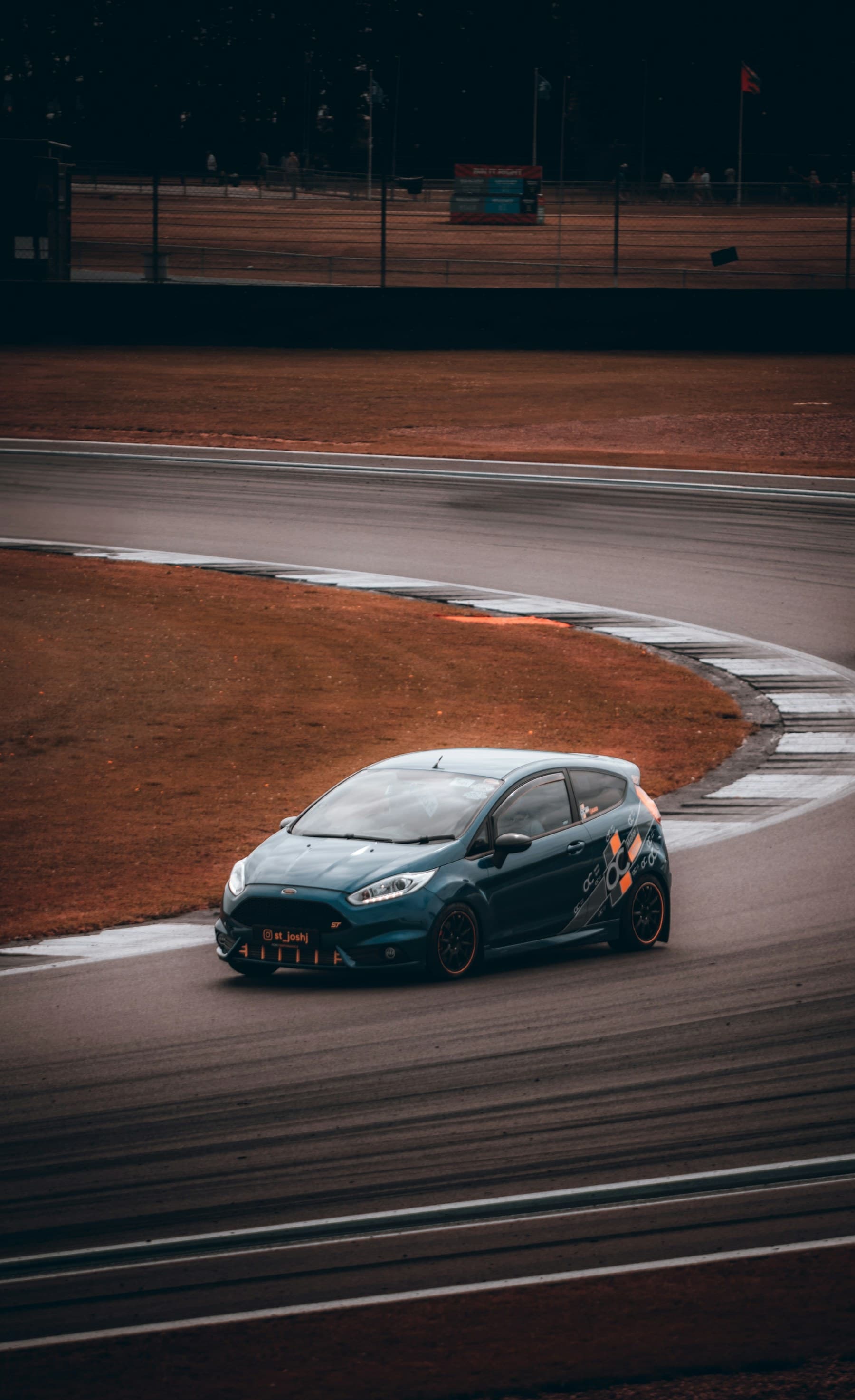Race car operating on a circuit at night