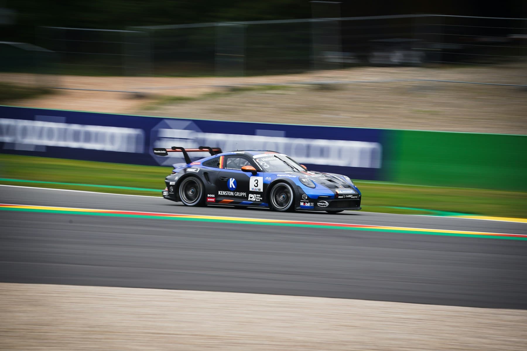 Race car at speed on a professional circuit